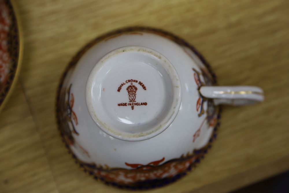 Copeland blue and gilt plates and four Royal Crown Derby cups and saucers